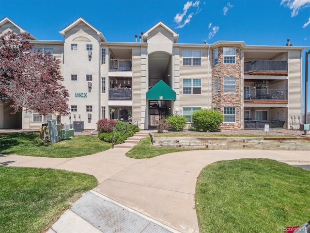 12348 W Dorado Pl Unit 204, Littleton, CO 80127 - view of building exterior featuring central AC unit