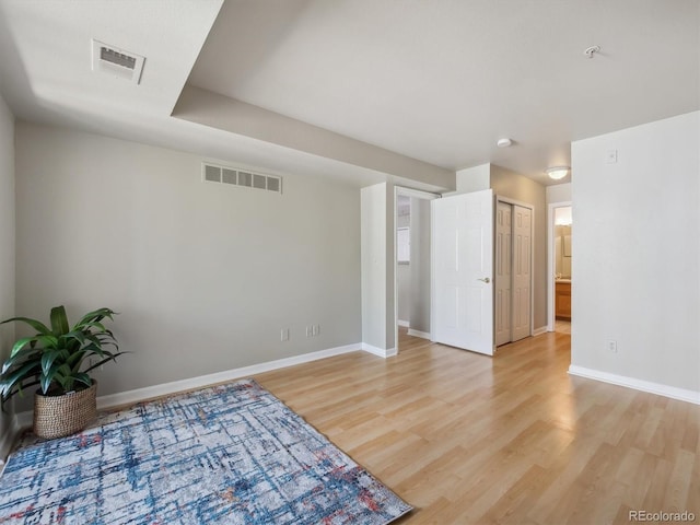 12348 W Dorado Pl Unit 204, Littleton, CO 80127 - unfurnished room with light wood finished floors, baseboards, and fire sprinkler in ceiling
