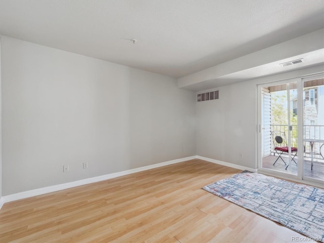 12348 W Dorado Pl Unit 204, Littleton, CO 80127 - unfurnished room with baseboards and wood finished floors