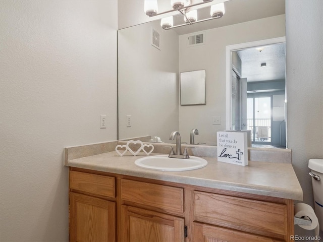 12348 W Dorado Pl Unit 204, Littleton, CO 80127 - bathroom featuring vanity and toilet