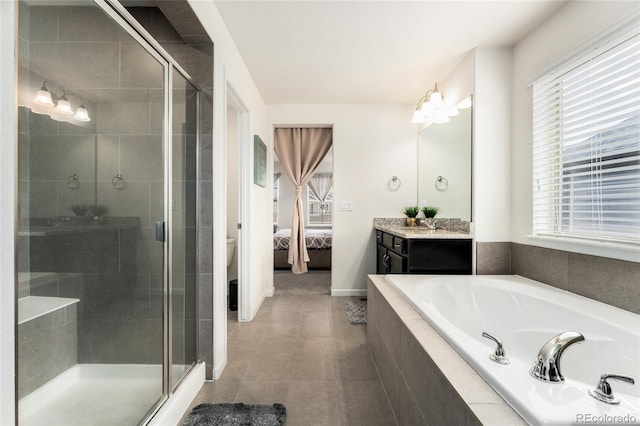 full bathroom featuring plenty of natural light, toilet, and separate shower and tub