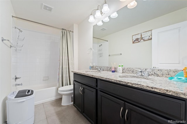 full bathroom with vanity, shower / tub combo with curtain, tile patterned floors, and toilet