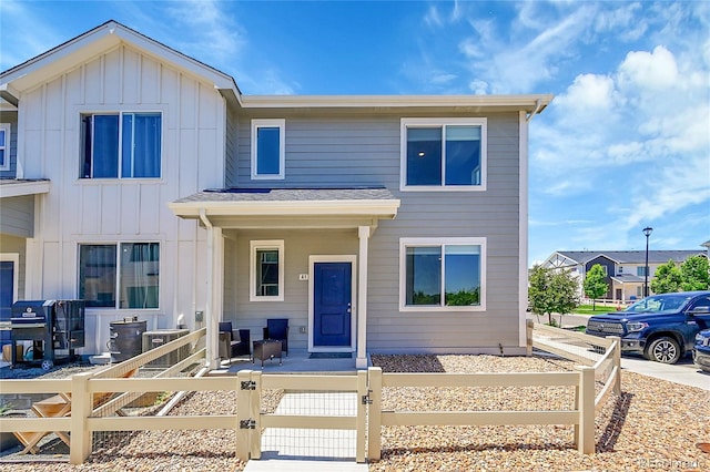 620 Apache Trl Unit A1, Ault, CO 80610 - view of property featuring a fenced front yard, a gate, and board and batten siding
