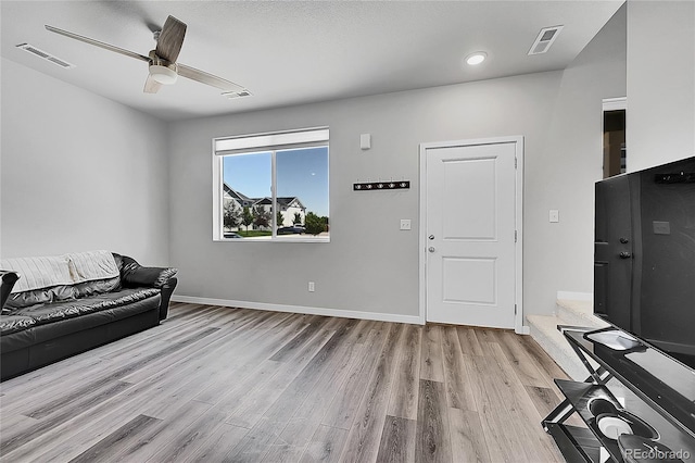 620 Apache Trl Unit A1, Ault, CO 80610 - living area with wood finished floors, ceiling fan, and recessed lighting