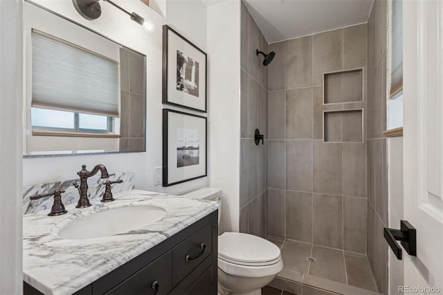 4634 W Tufts Cir, Denver, CO 80236 - bathroom featuring vanity and tiled shower