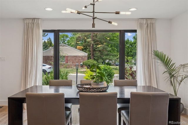 4634 W Tufts Cir, Denver, CO 80236 - dining area featuring plenty of natural light, recessed lighting, and wood finished floors