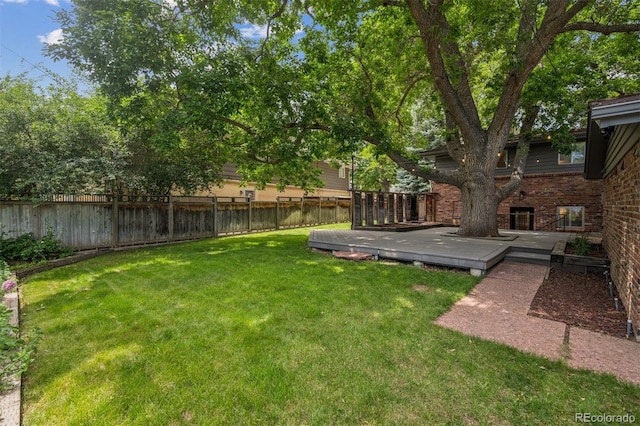 4634 W Tufts Cir, Denver, CO 80236 - fenced backyard featuring a deck