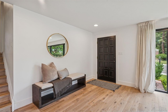 4634 W Tufts Cir, Denver, CO 80236 - entrance foyer with light wood finished floors, stairs, and recessed lighting