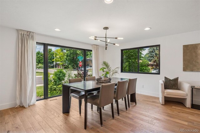 4634 W Tufts Cir, Denver, CO 80236 - dining space featuring a chandelier, light wood finished floors, and recessed lighting