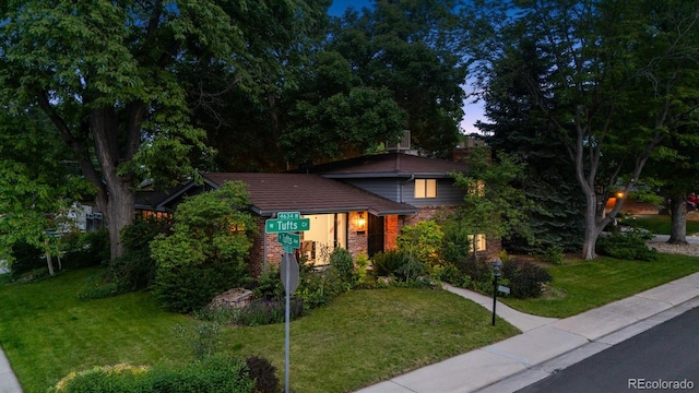 4634 W Tufts Cir, Denver, CO 80236 - split level home featuring a front yard and brick siding