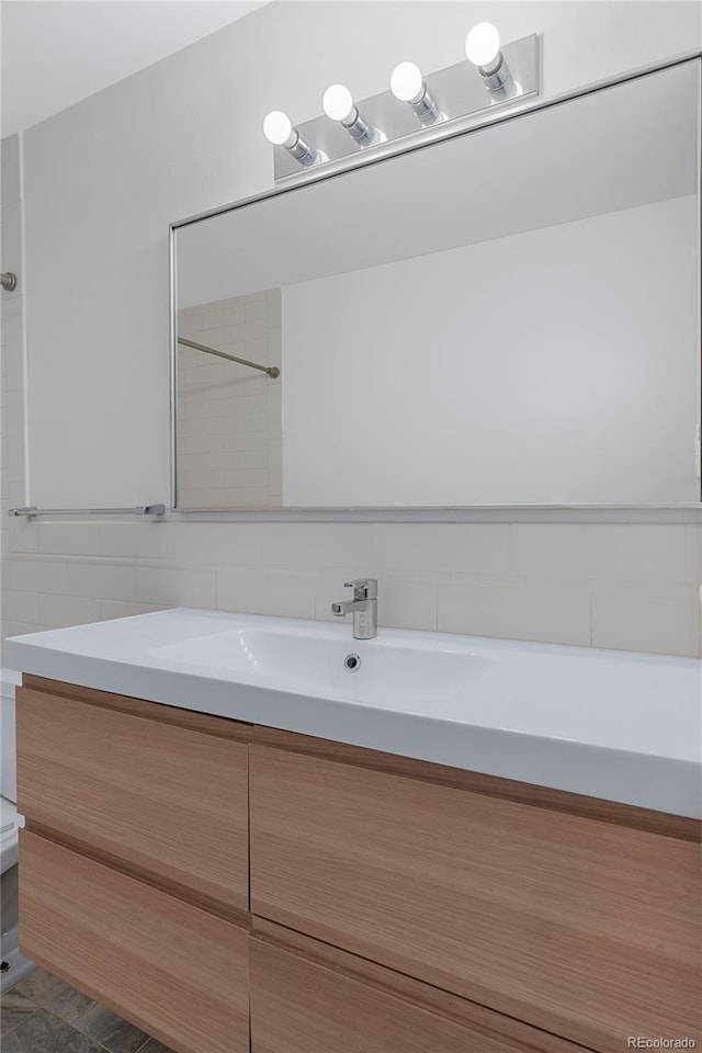 bathroom with tile patterned floors and vanity