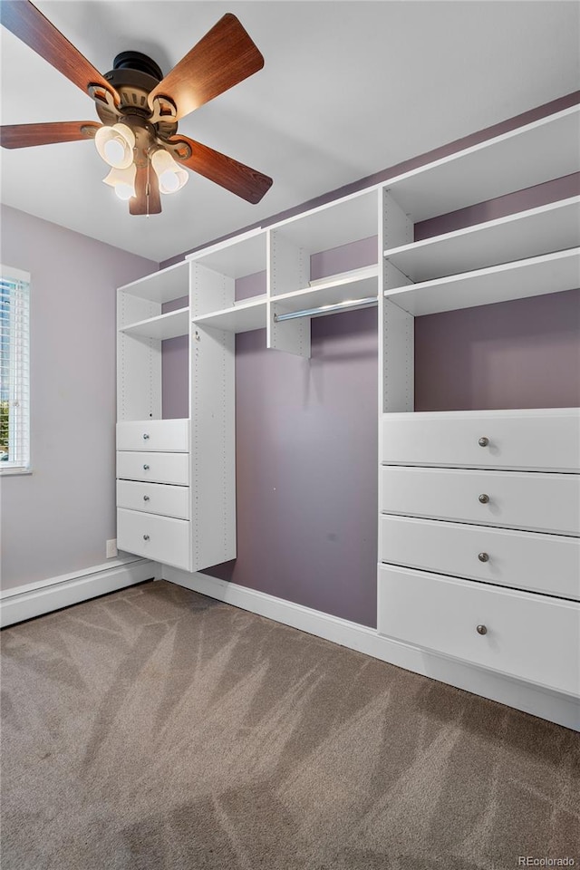 walk in closet featuring ceiling fan, carpet flooring, and baseboard heating