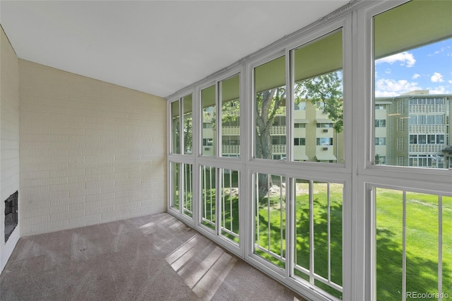 unfurnished sunroom with vaulted ceiling