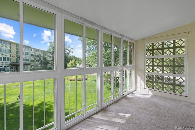 unfurnished sunroom with lofted ceiling and a healthy amount of sunlight