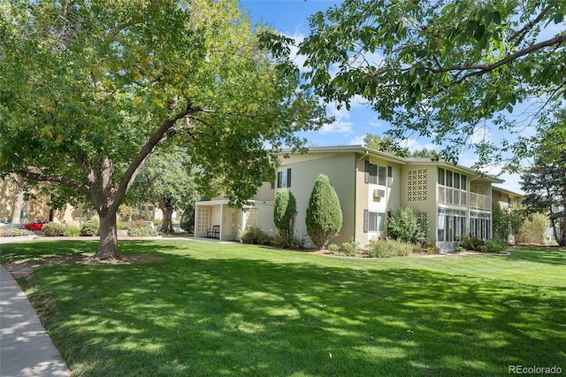 view of property exterior with a yard