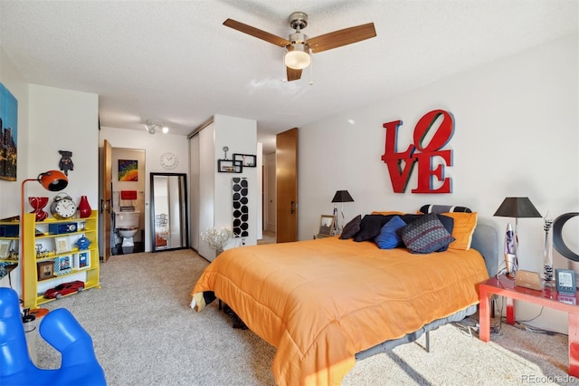 bedroom featuring ceiling fan, carpet flooring, a textured ceiling, and a closet