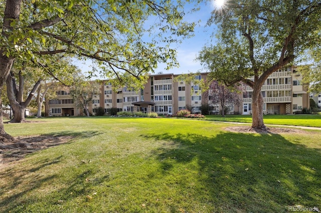 view of home's community with a lawn