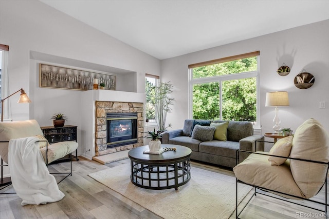11585 Decatur St Unit B, Denver, CO 80234 - living room with wood finished floors, a fireplace, and vaulted ceiling