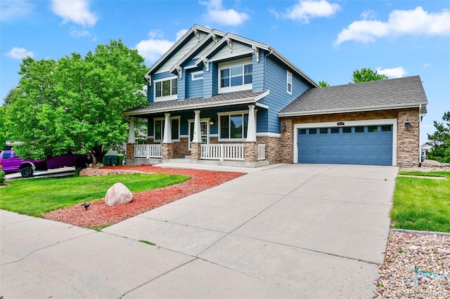 18967 W 54th Ln, Golden, CO 80403 - craftsman inspired home featuring covered porch, stone siding, concrete driveway, an attached garage, and a front lawn
