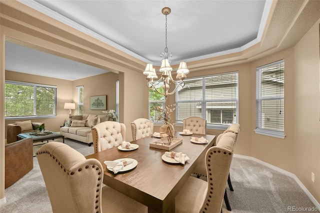 18967 W 54th Ln, Golden, CO 80403 - dining space featuring a chandelier, light colored carpet, a raised ceiling, and baseboards