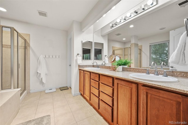 18967 W 54th Ln, Golden, CO 80403 - bathroom with a shower stall, double vanity, tile patterned floors, and recessed lighting