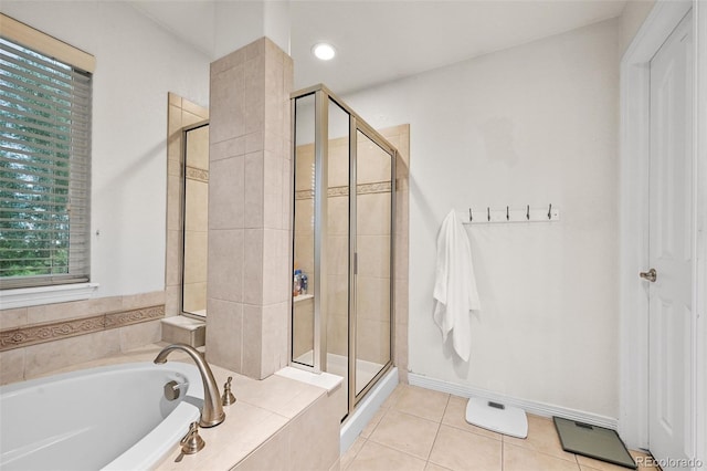 18967 W 54th Ln, Golden, CO 80403 - full bath with a stall shower, a garden tub, and tile patterned floors
