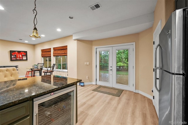 18967 W 54th Ln, Golden, CO 80403 - kitchen with freestanding refrigerator, beverage cooler, light wood-type flooring, recessed lighting, and baseboards