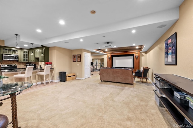 18967 W 54th Ln, Golden, CO 80403 - living area with recessed lighting, light carpet, a tray ceiling, and baseboards