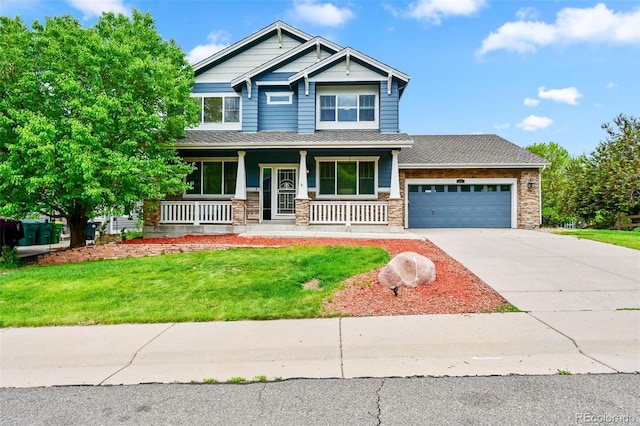 18967 W 54th Ln, Golden, CO 80403 - craftsman inspired home featuring an attached garage, a porch, concrete driveway, stone siding, and a front lawn