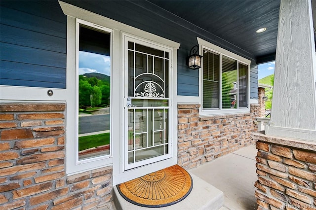 18967 W 54th Ln, Golden, CO 80403 - view of exterior entry featuring covered porch and brick siding