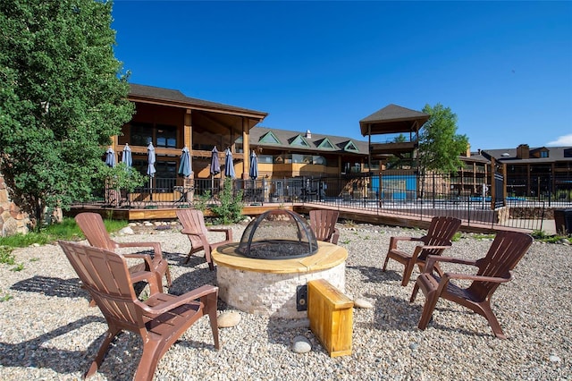 view of patio / terrace featuring an outdoor fire pit