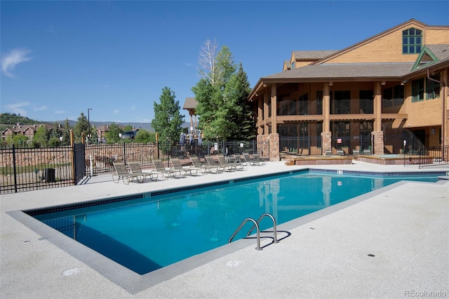 view of swimming pool with a patio