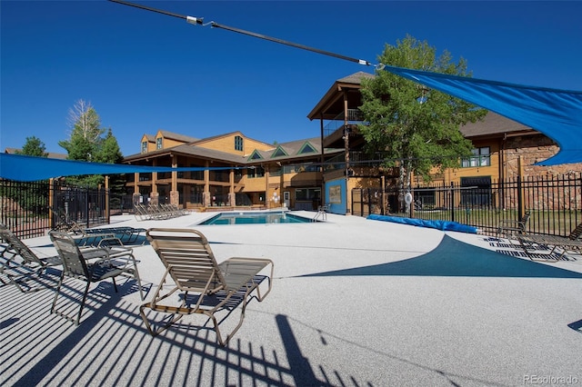 view of swimming pool with a patio area