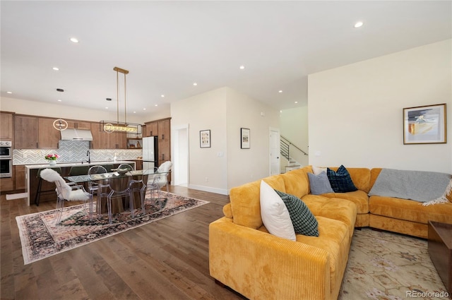 living room with dark hardwood / wood-style flooring