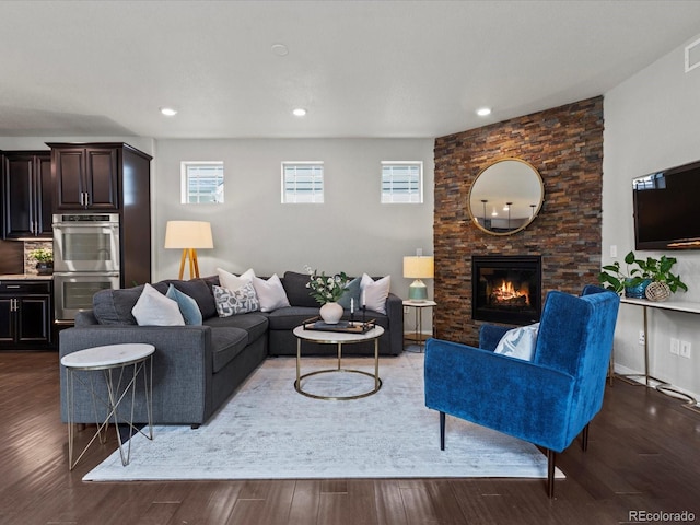 5445 Verbena St, Denver, CO 80238 - living room with a fireplace, wood finished floors, and recessed lighting