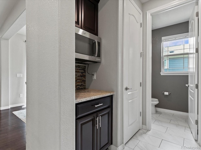 5445 Verbena St, Denver, CO 80238 - bar area with stainless steel microwave and light marble finish floors