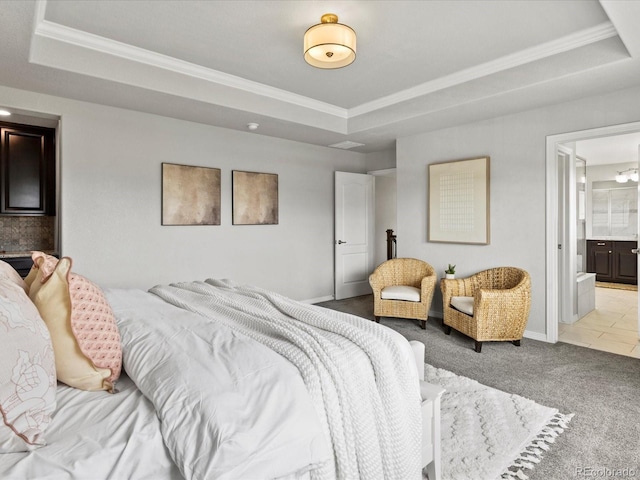5445 Verbena St, Denver, CO 80238 - carpeted bedroom featuring a tray ceiling, ornamental molding, and connected bathroom