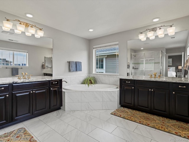 5445 Verbena St, Denver, CO 80238 - bathroom with a shower stall, two vanities, plenty of natural light, and recessed lighting