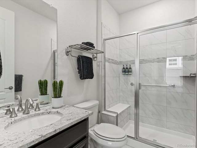 5445 Verbena St, Denver, CO 80238 - bathroom featuring vanity and a stall shower