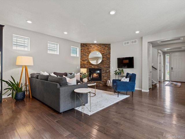 5445 Verbena St, Denver, CO 80238 - living area with dark wood-type flooring, a fireplace, stairs, and recessed lighting