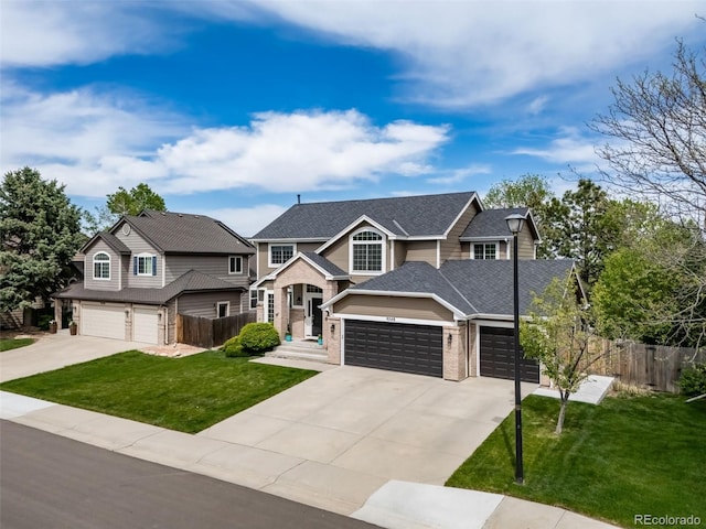 9548 La Quinta Dr, Lone Tree, CO 80124 - view of front of house with concrete driveway, brick siding, and an attached garage