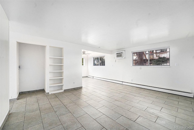 tiled empty room featuring a baseboard radiator, a wall unit AC, ceiling fan, and built in shelves