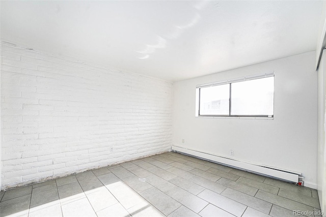 tiled spare room with a baseboard radiator and brick wall