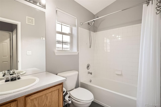 full bathroom with toilet, vaulted ceiling, shower / bath combo, and vanity