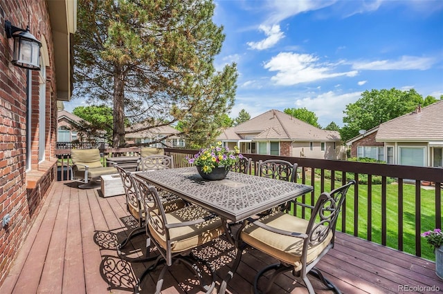 6500 W Mansfield Ave Unit 39, Denver, CO 80235 - wooden deck featuring a lawn and outdoor dining space