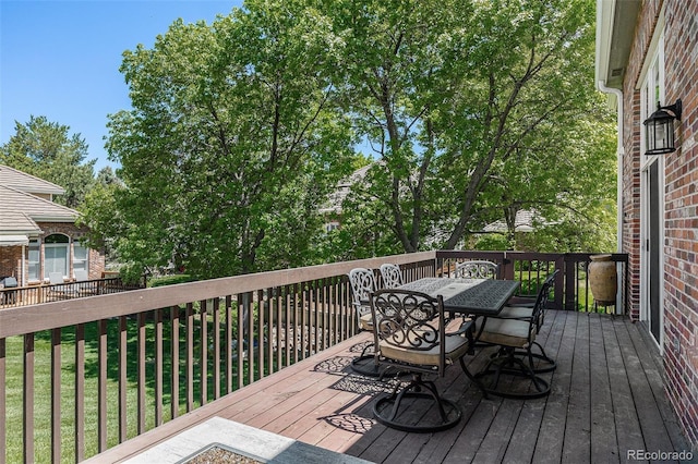 6500 W Mansfield Ave Unit 39, Denver, CO 80235 - wooden deck featuring outdoor dining space