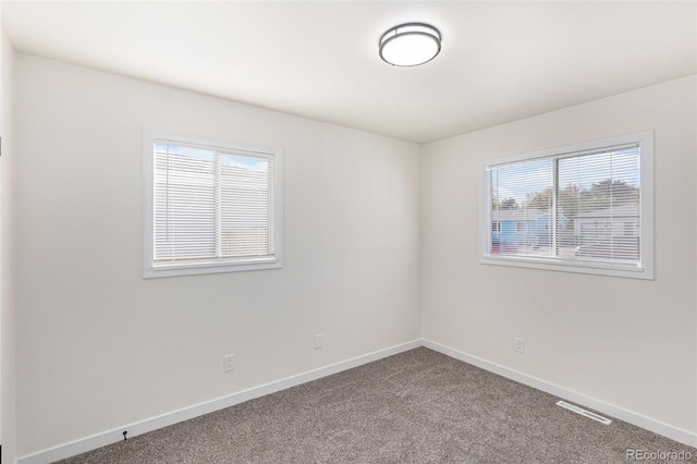 unfurnished room featuring carpet flooring