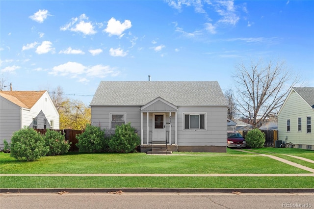 bungalow-style house featuring a front yard