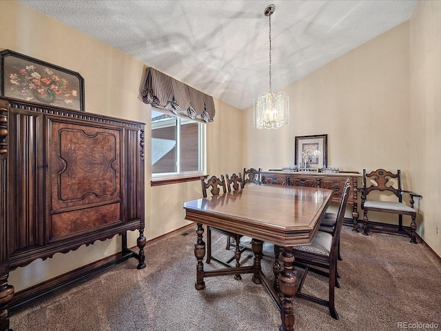 carpeted dining area featuring a chandelier, a textured ceiling, and vaulted ceiling