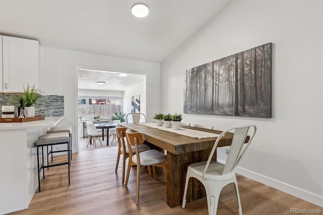 1418 5th St, Fort Lupton, CO 80621 - dining area featuring light wood finished floors and lofted ceiling